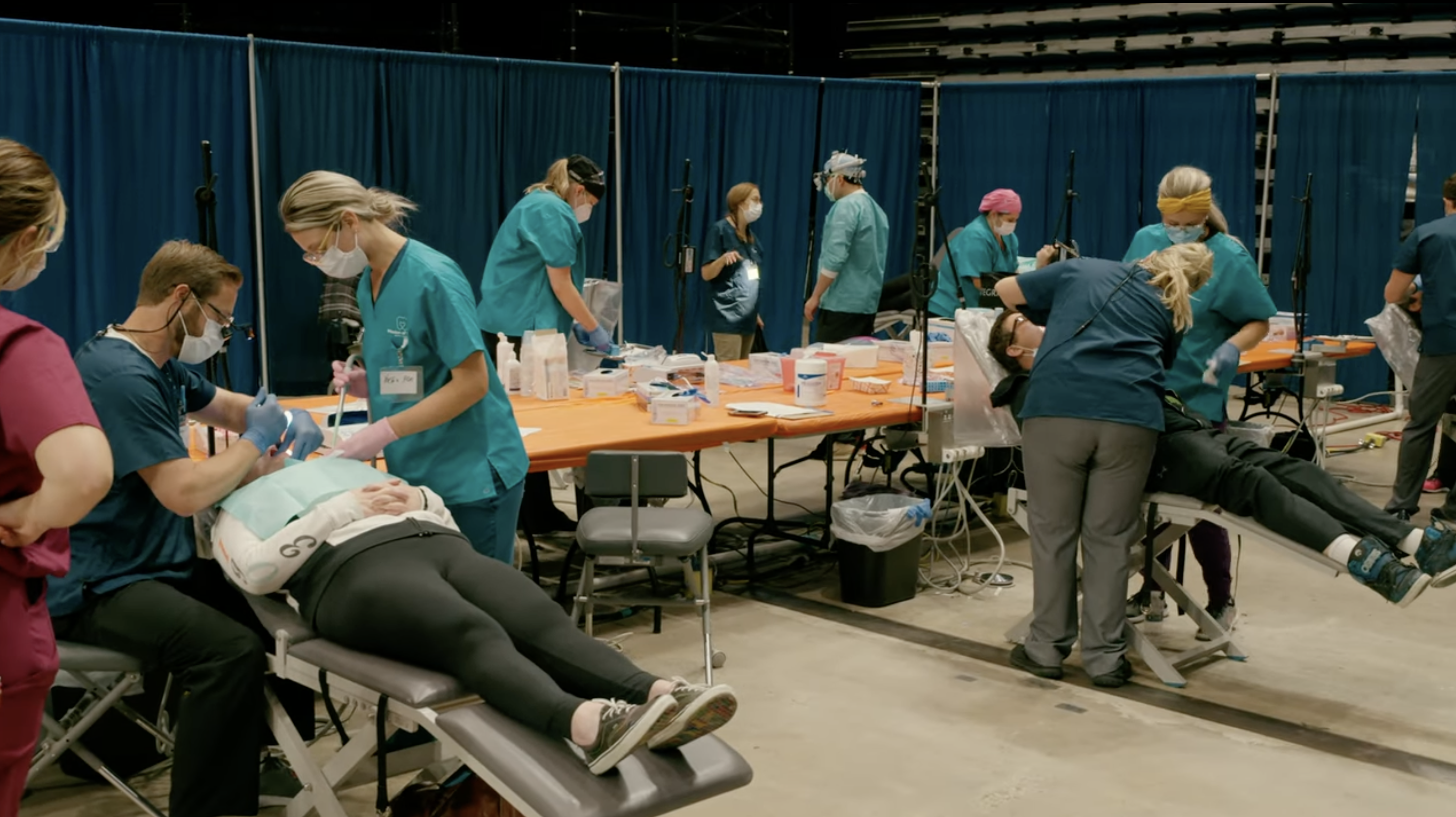 Mission of Mercy 2021 • professionals providing dental services on patients