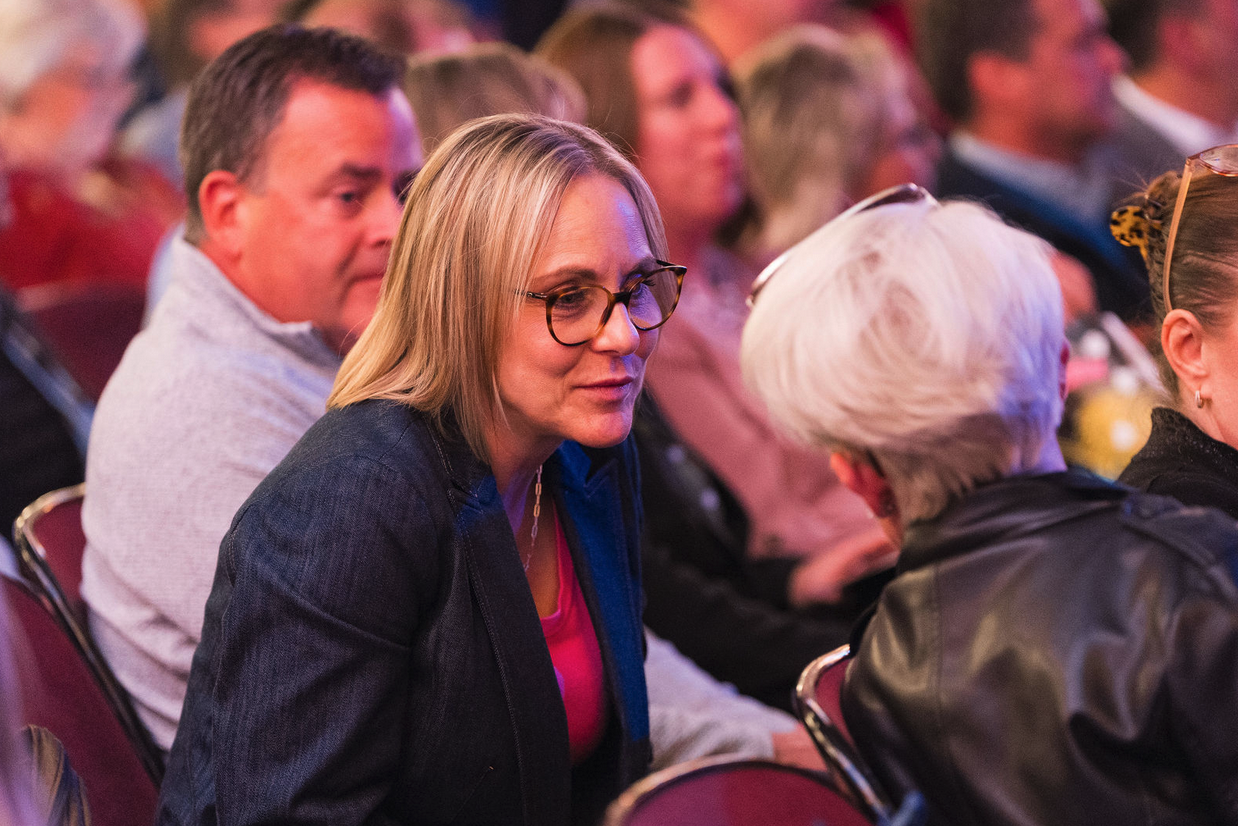 women in crowd conversing